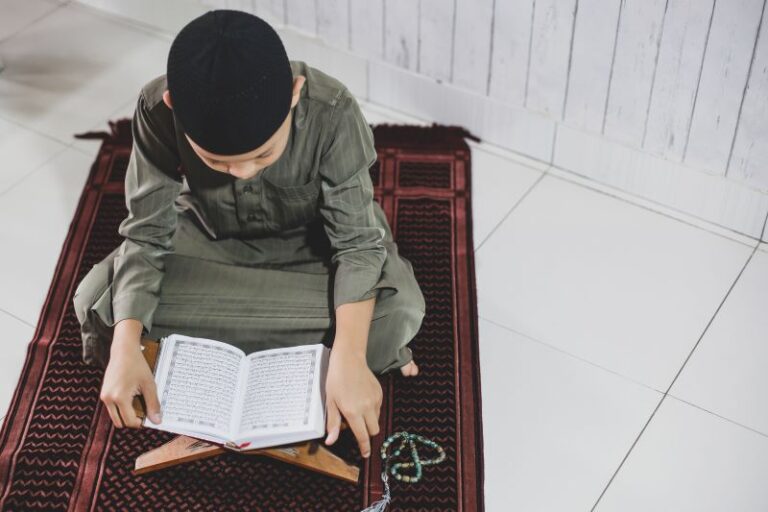 portrait-asian-muslim-boy-wearing-traditional-costume-was-reading-holy-book-alquran-p1-min